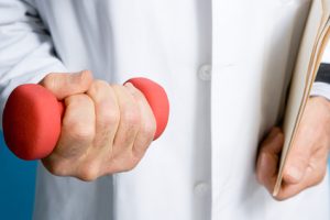 Doctor holding a dumbbell